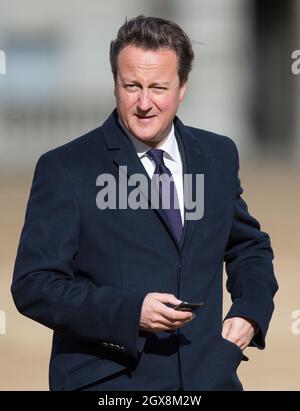 Britain's Prime Minister David Cameron attends a Ceremonial Welcome for the President of Singapore, Tony Tan, at Horse Guards Parade in London.  Stock Photo