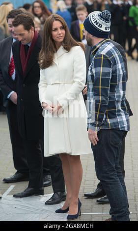 Catherine, Duchess of Cambridge, wearing a Max Mara Villar belted wool coat, visits the new home of Ben Ainslie Racing and the 1851 Trust in Portsmouth on February 12, 2015. Stock Photo