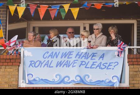 Crowds hold up a placard as Catherine, Duchess of Cambridge visits the Turner Contemporary art gallery in Margate on March 11, 2015.  Stock Photo