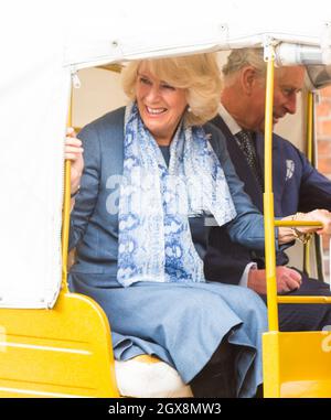 Prince Charles, Prince of Wales and Camilla, Duchess of Cornwall ride in a rickshaw as they attend the launch of 'Travels to my Elephant' Rickshaw Race at Clarence House in London on March 26, 2015. Stock Photo