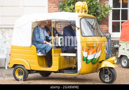 Prince Charles, Prince of Wales and Camilla, Duchess of Cornwall ride in a rickshaw as they attend the launch of 'Travels to my Elephant' Rickshaw Race at Clarence House in London on March 26, 2015. Stock Photo