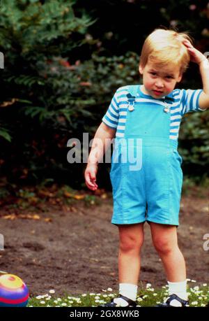 Prince William celebrates his 2nd Birthday by playing football in the gardens of Kensington Palace on June 21st, 1984. Prince Charles jokingly nicknamed his son 'wombat' during the photocall. Royals, William, Child, Sport, Casual, Full length  Â©Anwar Hussein/allaction.co.uk    Stock Photo