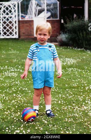 Prince William celebrates his 2nd Birthday by playing football in the gardens of Kensington Palace on June 21st, 1984. Prince Charles jokingly nicknamed his son 'wombat' during the photocall. Royals, William, Child, Sport, Casual, Full length  Â©Anwar Hussein/allaction.co.uk    Stock Photo