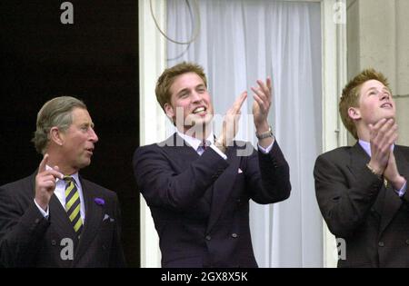 The Prince of Wales with his sons Prince William  and Prince Harry watch the flypast by Concorde and the Red Arrows, from the balcony of Buckingham Palace on June 4th 2002.  Photo.  Anwar Hussein  Stock Photo