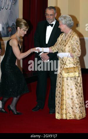 Madonna meets Her Majesty Queen Elizabeth II at the World Premiere of the James Bond film Die Another Day held at London's Royal Albert Hall. full length. curtsey. black dress. jewellery. white gloves. funny. fashion.   NO UK SALES FOR 3 MONTHS FROM 181102  Stock Photo