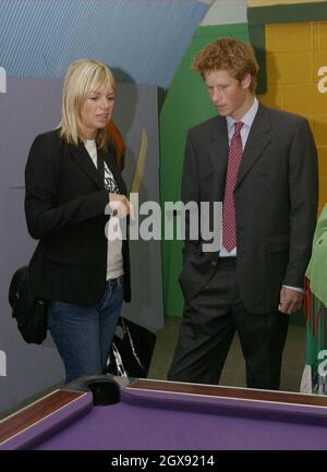 Prince Harry talks with radio and television presenter Zoe Ball at Kids Company, Peckham, South London, during a visit. He was spending the day visiting charities and causes which he intends to support.  Prince Harry is 18 on Sunday September 15 2002.    Stock Photo