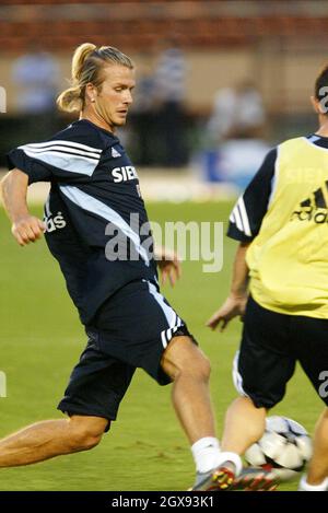 Real Madrid's David Beckham, left, fights for the ball during a training session at Tokyo's National Stadium.  Football, ponytail. Â©IPJ/Fujifotos/allaction.co.uk  Stock Photo