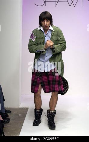 Anthony Kiedis on the catwalk at the Shawn Fashion show in Los Angeles.    Kilt, boots, red hot Chili peppers Stock Photo