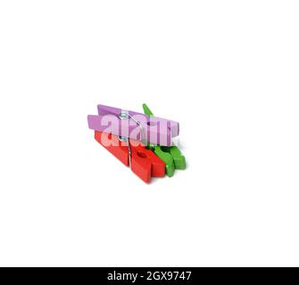 wooden multicolored clothespins isolated on white background, top view Stock Photo