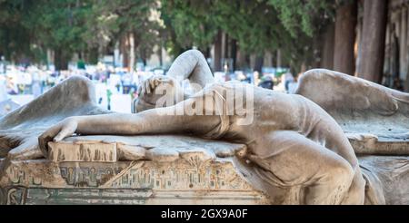 GENOA, ITALY - June 2020: antique statue of angel (1910, marble) in a Christian Catholic cemetery - Italy Stock Photo