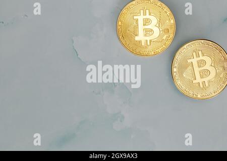 Golden Bitcoins Cryptocurrency top view stack of Digital coins on gray marble desk table background.Flat lay blank text.Copy space for word. concrete Stock Photo