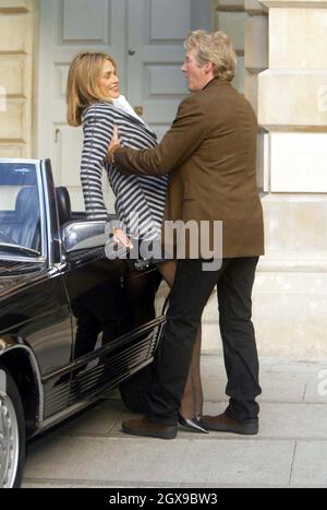 Richard Gere and Lauren Hutton at the exhibition called Giorgio Armani: A Retrospective, which is held at the Royal Academy of Arts' new space in Burlington Gardens, London. One of the actor's famous roles was in the film American Gigolo, in which  he played opposite the beautiful model. Gere's character was kitted out from head to toe in the Italian designer's clothes. The Mercedes seen in the picture is also from the legendary movie. PHOTOGRAPH IS FOR EDITORIAL USE ONLY. Stock Photo