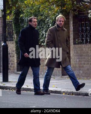 Johnny Vaughn and a friend walking in west London  and browsing in a book shop. A book called Johnny Got His Gun grabbed the TV presenters attention. Stock Photo