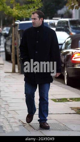 Johnny Vaughn and a friend walking in west London  and browsing in a book shop. A book called Johnny Got His Gun grabbed the TV presenters attention. Stock Photo