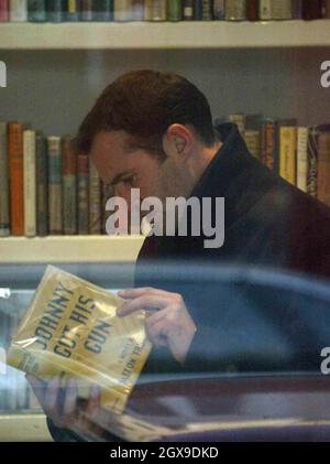 Johnny Vaughn and a friend walking in west London  and browsing in a book shop. A book called Johnny Got His Gun grabbed the TV presenters attention. Stock Photo