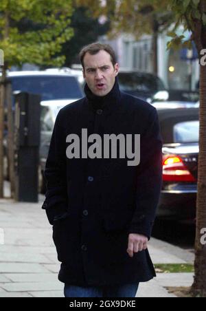 Johnny Vaughn and a friend walking in west London  and browsing in a book shop. A book called Johnny Got His Gun grabbed the TV presenters attention. Stock Photo