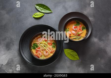 Laksa Soup – a Malaysian  Coconut Curry  Soup with shrimps over rice noodles topped with fresh bean spouts,cucumber, lime, red chili pepper and cilant