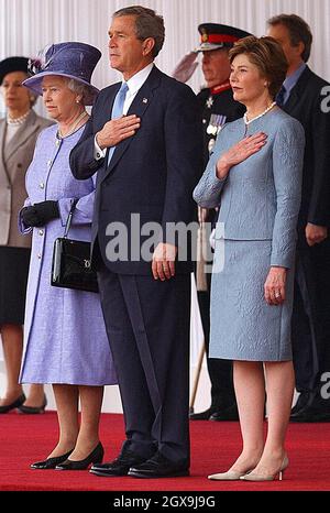 Queen Elizabeth II (left) stands alongside America's President George Bush and his wife Laura on the forecourt of Buckingham Palace in London at the start of the President's state visit to Britain. Â©Anwar Hussein/allactiondigital.com  Stock Photo