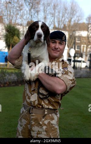 Buster a five-ear-old springer spaniel, with his handler Sergeant Danny Morgan and Kate Adie at the Imperial War Museum.  Buster is considered responsible for saving countless lives when he located a hidden cache of arms, explosives and bomb-making equipment in buildings thought to be the headquarters of extremists responsible for attacks on British Forces  during the recent conflict in Iraq.      Stock Photo