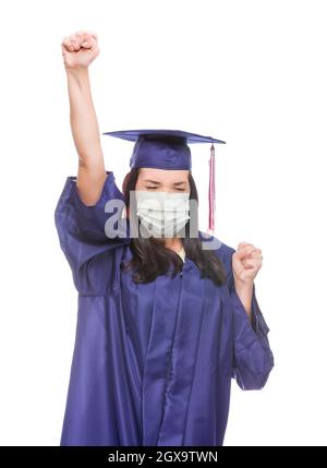Graduating Female Wearing Medical Face Mask and Cap and Gown  Cheering Isolated on a White Background. Stock Photo