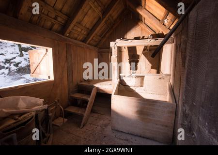 interior of retro wooden watermill with old equipment Stock Photo