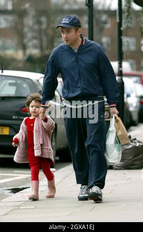 Damon Albarn holds hands with his daughter after a shopping trip in ...