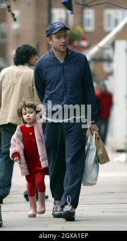 Damon Albarn holds hands with his daughter after a shopping trip in ...