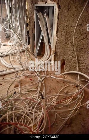 Socket back boxes with wires in a wall. Cabling background. electrical wires sticking out from electrical sockets hole on the wall. New electrical wir Stock Photo