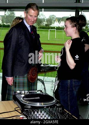 The Prince of Wales known as the Duke of Rothsey in Scotland - speaks to Lynsey Robertson after a  performance by a group of students taking part in the Sound Live section of the Princess Trust (a six month programme which develops young people's musical talents, self-confidence and skills) at Dundee College, Dundee.  Stock Photo