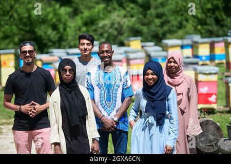 african muslim people group visiting local honey production farm Stock Photo