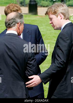 Prince Charles and his son Prince William talk with the brother of the late Princess Diana, Earl Spencer, during the unveiling of a memorial fountain dedicated to Diana at Hyde Park in London. Stock Photo