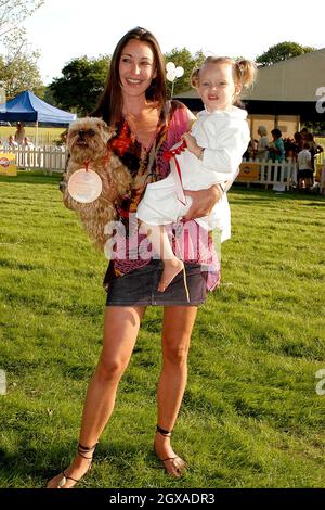 Tamara Mellon (Jimmy Choos) with her daughter Minty and dog Biscuit at the Macmillan Dog Day in aid of Macmillan Cancer Relief, at the Royal Hospital Chelsea, London. Stock Photo