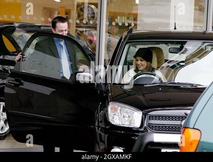 Pop star Cheryl Tweedy buys a brand new 22,000 4x4 and immediately drives it away. Stock Photo