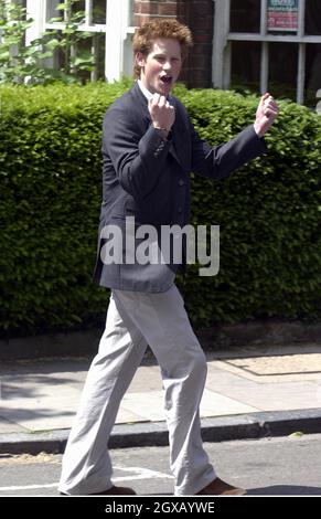 Archive picture of the jubilant Prince Harry leaving Manor House as he finishes his schooldays at Eton College on June 12, 2003. The 'playboy' prince has made the headlines once again, after attending a fancy dress party  with a nazi swastika on his arm. The lastest scandal follows a succession incidents which have seen the 20 year old prince caught smoking cannabis as a teenager to his more recent nightclub scuffle with a paparazzi photographer. Anwar Hussein/allactiondigital.com   Stock Photo