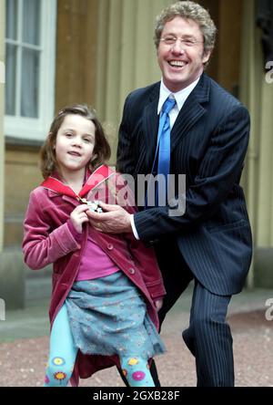 Roger Daltrey from the The Who poses with his grand-daughter Lily, 6, in the courtyard of Buckingham Palace in central London, Wednesday February 9, 2005. The singer had just been honoured as a Commander of the British Empire (CBE) for services to music. Anwar Hussein/allactiondigital.com   Stock Photo