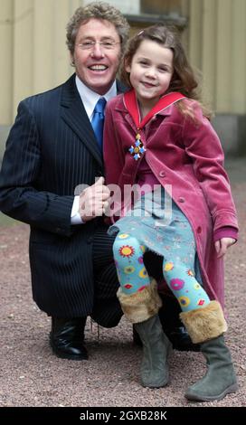 Roger Daltrey from the The Who poses with his grand-daughter Lily, 6, in the courtyard of Buckingham Palace in central London, Wednesday February 9, 2005. The singer had just been honoured as a Commander of the British Empire (CBE) for services to music. Anwar Hussein/allactiondigital.com   Stock Photo