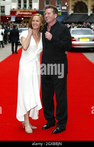 Val Kilmer and Charlotte Emmerson arrives at the European Premier of BATMAN BEGINS at the Odeon Leicester square Stock Photo