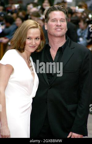 Val Kilmer and Charlotte Emmerson at the European premiere of Batman Begins. It was screened at the Odeon Leicester Square cinema in London. Stock Photo