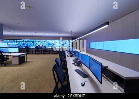 Empty interior of big modern security system control room, workstation with multiple displays, monitoring room with at security data center  Empty off Stock Photo