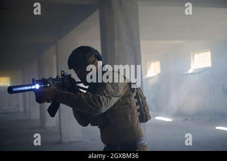 modern warfare soldier in urban environment  battlefield aiming on weapons and scanning for target Stock Photo