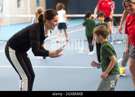 Catherine, Duchess of Cambridge takes part in a Tennis for Kids session during a visit to the Lawn Tennis Association National Tennis Centre in London on October 31, 2017. Stock Photo