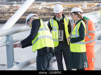 Prince William, Duke of Cambridge wears a hard-hat, high-vis vest and safety goggles as he helps screw in final nuts and bolts on the new Northern Spire bridge over the River Wear in Sunderland on February 21, 2018. Stock Photo