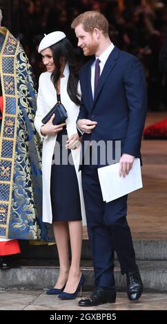 Prince Harry and Meghan Markle, wearing a cream Amanda Wakeley coat and matching hat, attend the Commonwealth Service at Westminster Abbey in London on March 12, 2018. Stock Photo