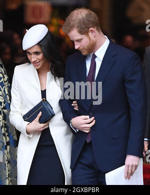 Prince Harry and Meghan Markle, wearing a cream Amanda Wakeley coat and matching hat, attend the Commonwealth Service at Westminster Abbey in London on March 12, 2018. Stock Photo
