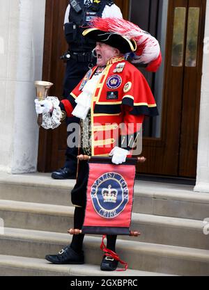 Town Crier Tony Appleton announces the birth of a third child for the Duke and Duchess of Cambridge outside the Lindo Wing of St. Mary's Hospital in London on April 23, 2018.  The baby boy is fifth in line to the throne. Stock Photo