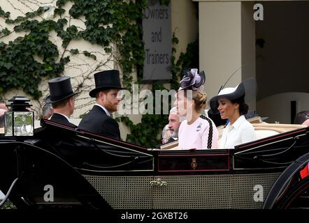 The Duke and Duchess of Sussex and the Countess of Wessex arrive in an open carriage to attend the first day of Royal Ascot on June 19, 2018 Stock Photo