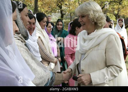 Camilla, Duchess of Cornwall meets local women when she visits a mountain village near Skardu in the Pakistan Himalayas on November 3, 2006. Anwar Hussein/EMPICS Entertainment  Stock Photo