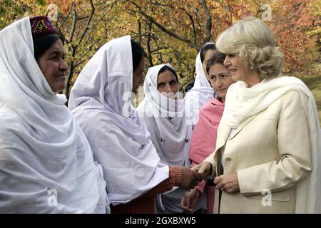 Camilla, Duchess of Cornwall meets local women when she visits a mountain village near Skardu in the Pakistan Himalayas on November 3, 2006. Anwar Hussein/EMPICS Entertainment  Stock Photo