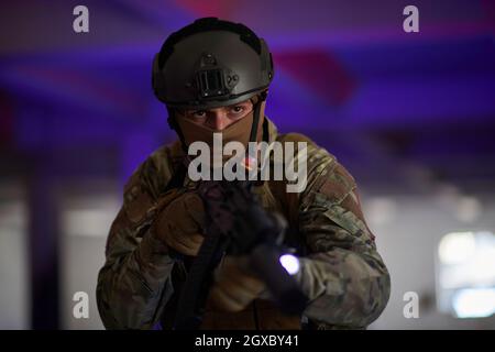 modern warfare soldier in urban environment  battlefield aiming on weapons and scanning for target Stock Photo