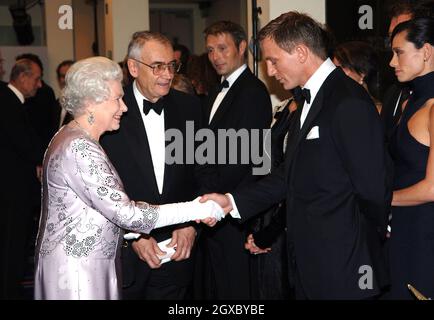 Queen Elizabeth ll shakes hands with Daniel Craig, the new James Bond, at the Royal Premiere for the 21st Bond film 'Casino Royale' at the Odeon in Leicester Square, London. Stock Photo